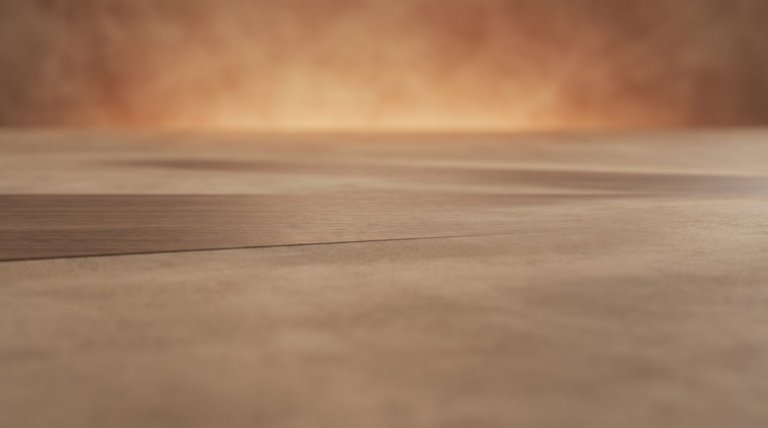 An abstract warm composition of a low plane receding toward a soft glow, evoking viewing distance and sightline