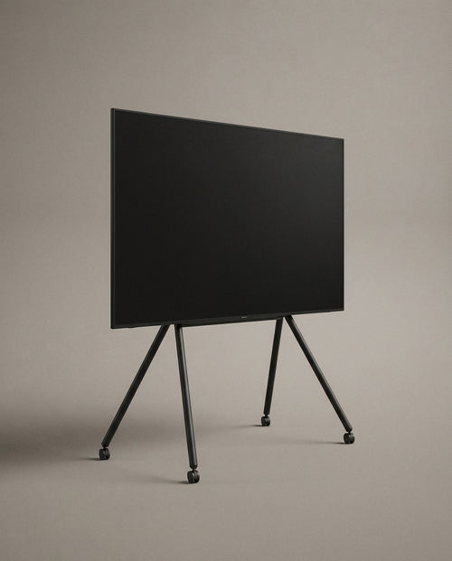 Black Studio TV Stand at a three-quarter angle against a plain studio backdrop
