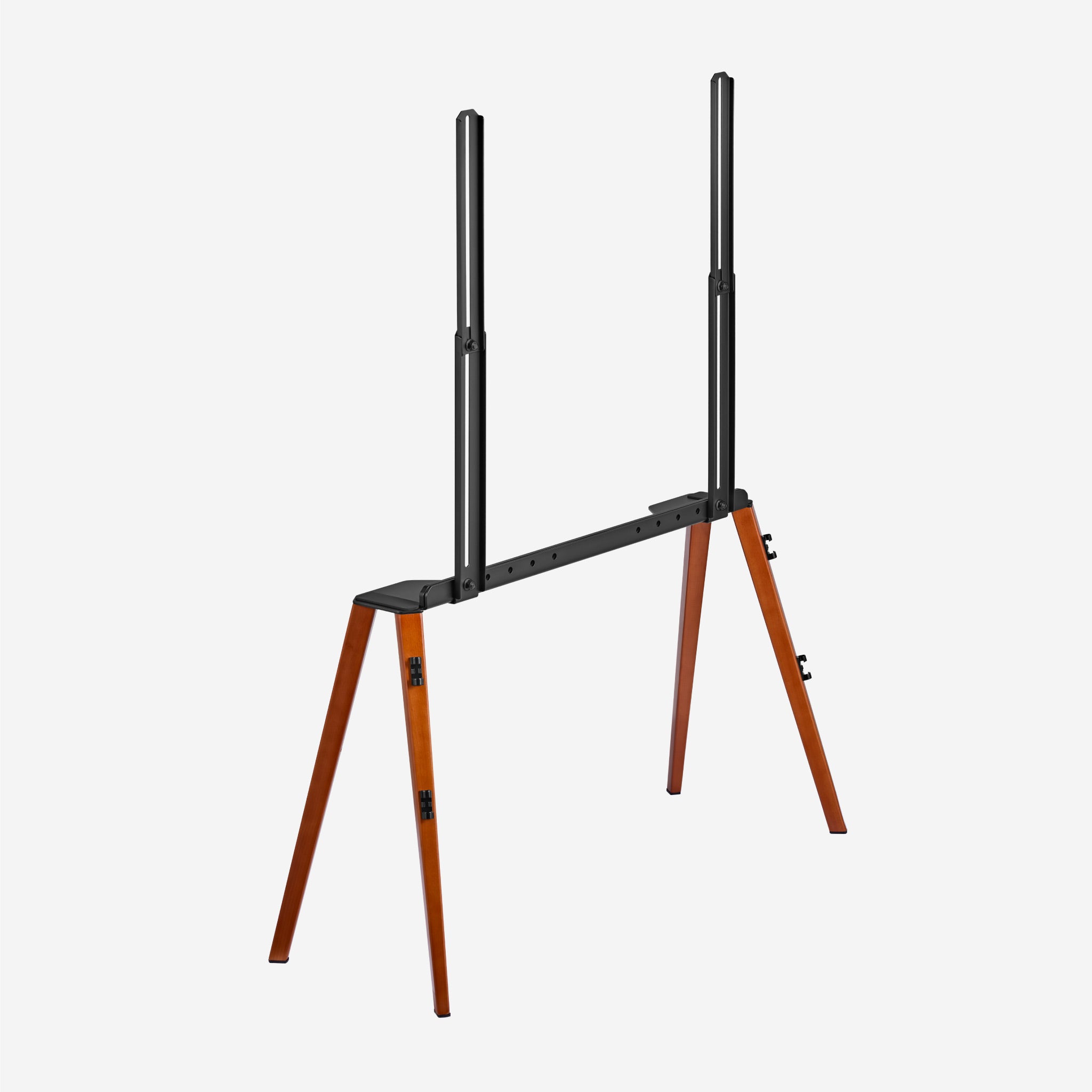 Walnut EASEL TV stand seen diagonally from the back, black steel rails and walnut legs
